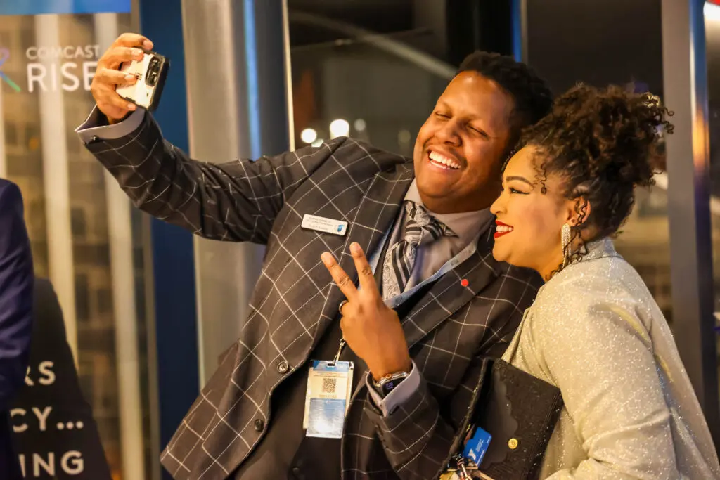 Guests taking a selfie at the Comcast RISE Day celebration in Colorado Springs, Colorado.