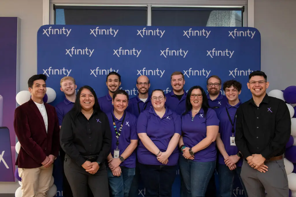 Xfinity Store employees posing for a picture.