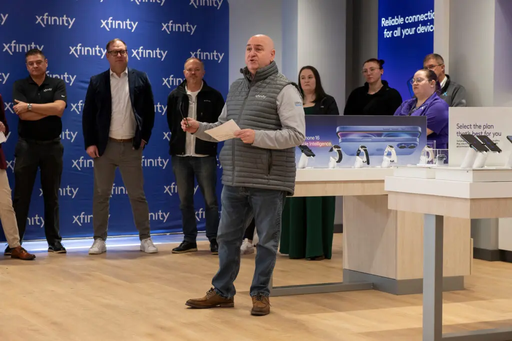 Ron Orlando, Comcast vice president of external affairs in the Mountain West Region, speaking with guests inside the new Xfinity Store in Fort Collins.