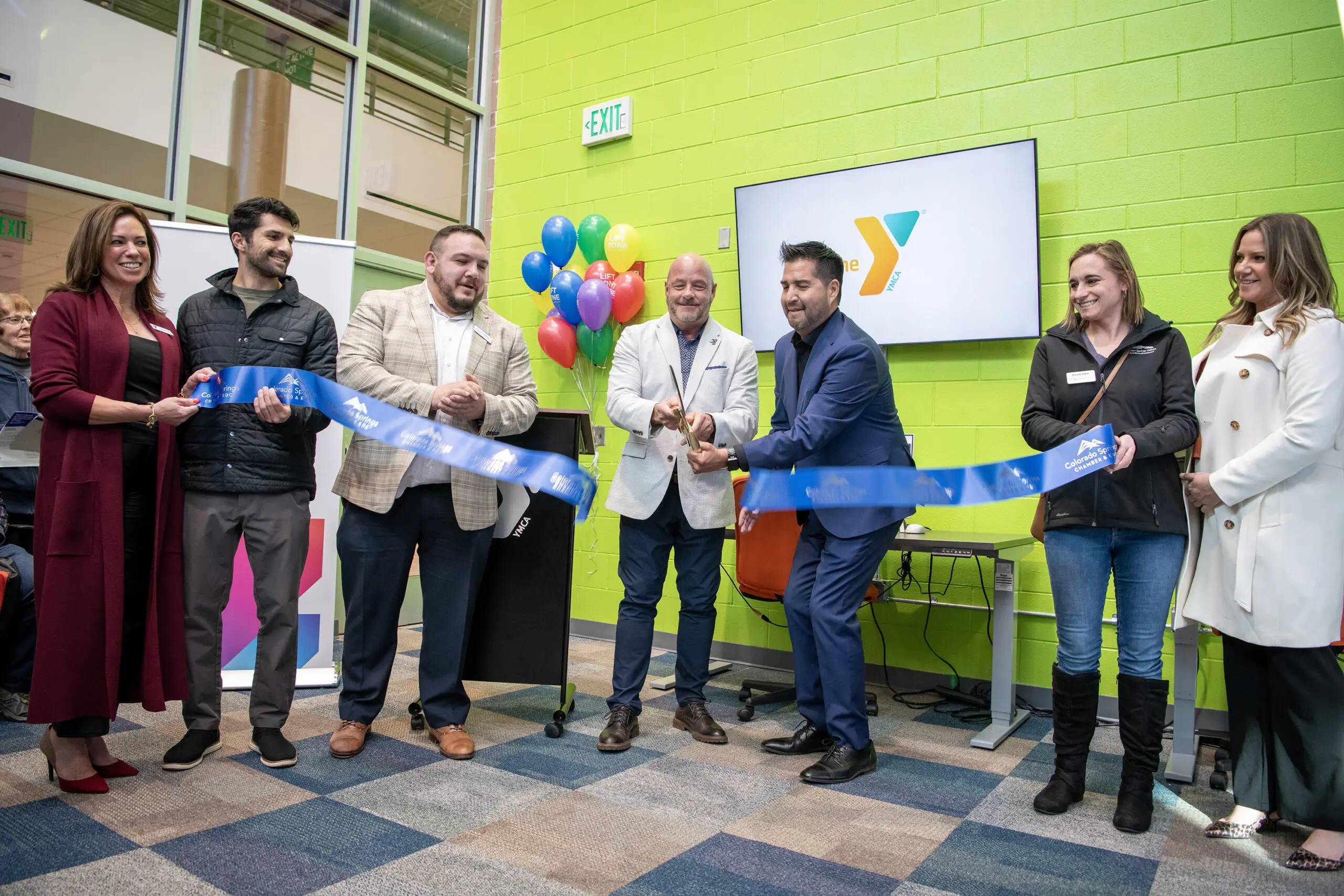 Comcast, YMCA and city leaders cutting a ribbon at the new YMCA Connection Center.