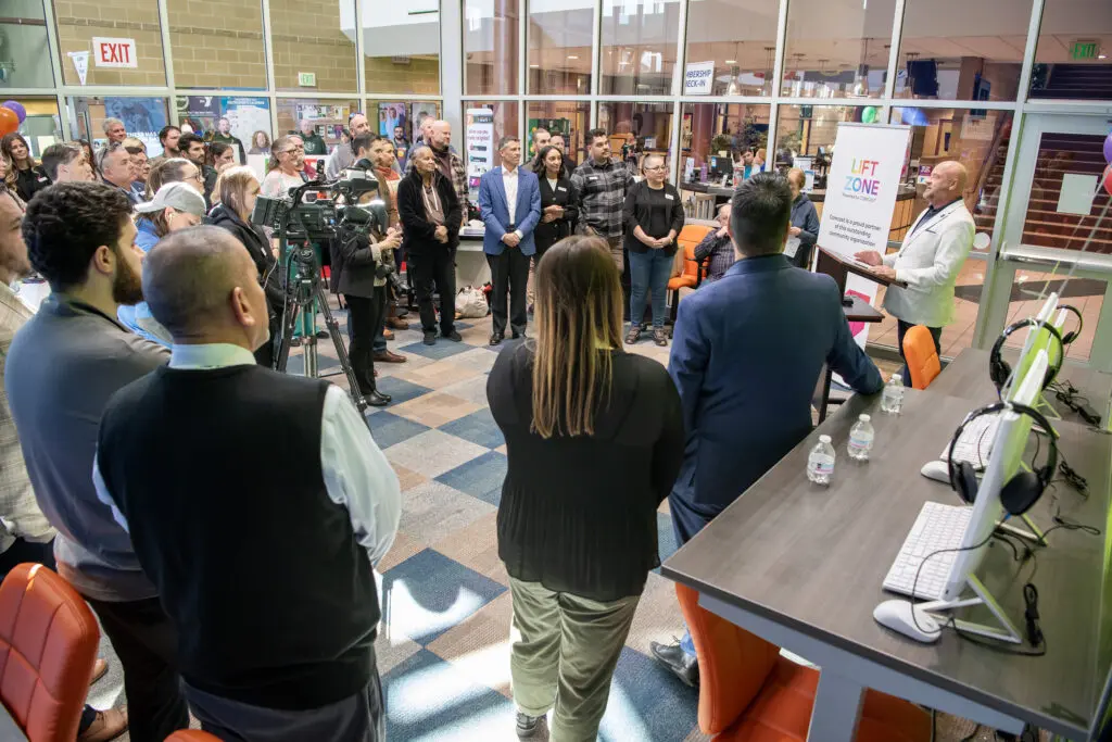 Guests listening to a guest speaker at the new YMCA Connection Center grand opening.