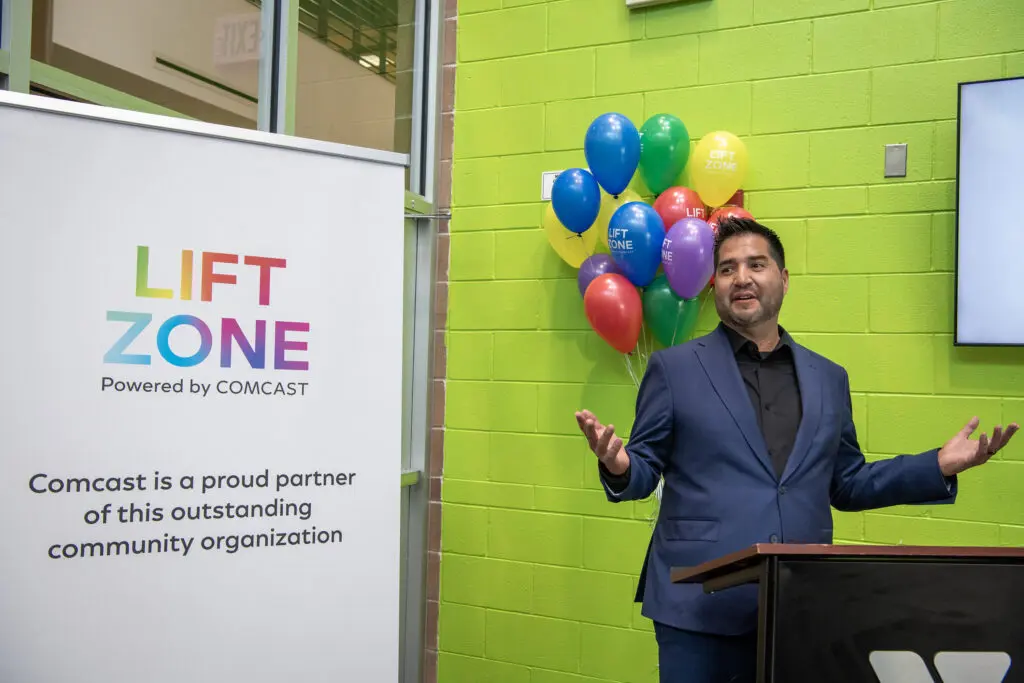 Comcast's Gary Amella speaks at the grand opening of the Lift Zone at the Southeast Armed Services YMCA.