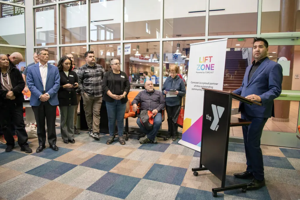 Comcast Gary Amella speaks at the grand opening of the Lift Zone at the Southeast Armed Services YMCA on Friday.