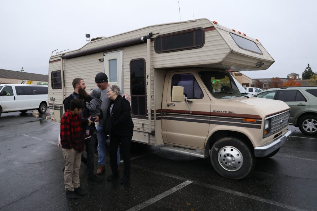 Woody and Luna with the first family of six they donated an RV to over Thanksgiving.