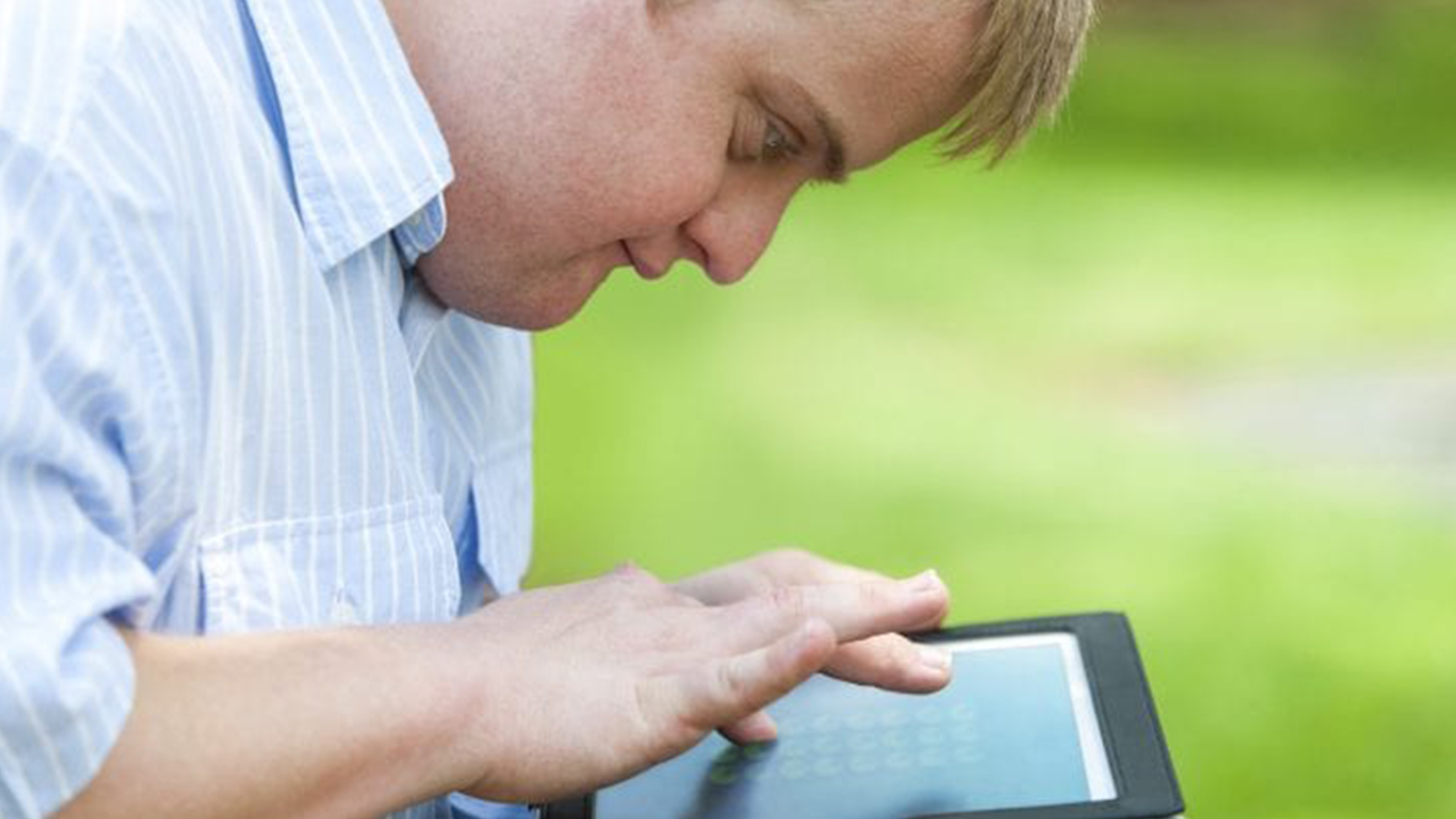 Male using a tablet.