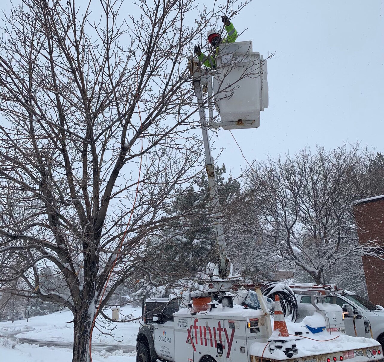 Comcast technician working after a snowstorm.